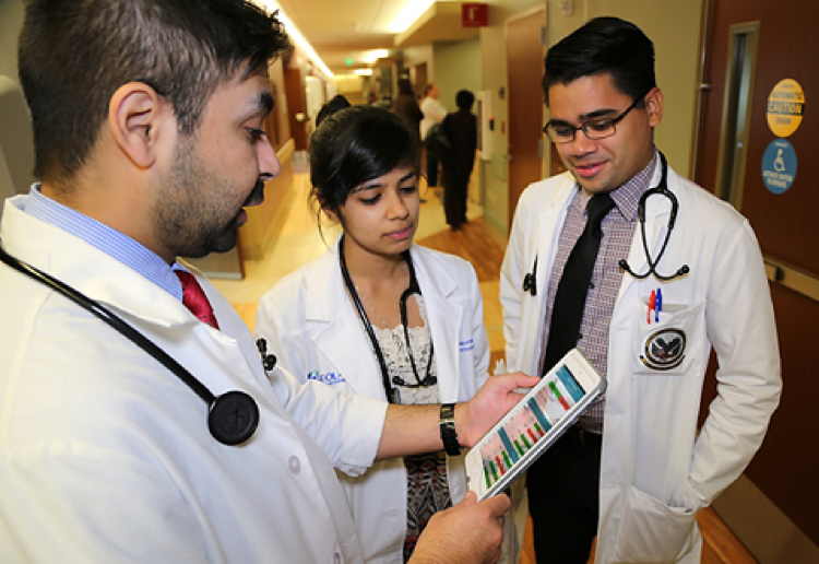 Three doctors discussing about report